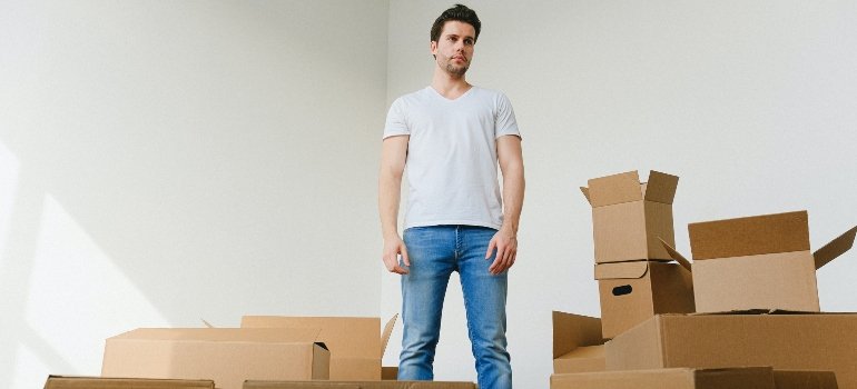 Man surrounded by boxes